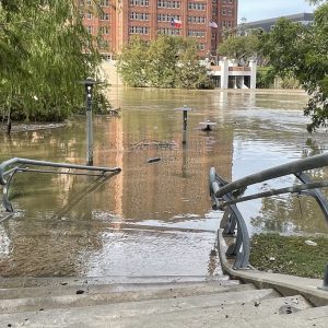 Allen’s Landing in the downtown area is the convergence of two bayous - Buffalo Bayou and White Oak Bayou. This park is wide with a steep slope to hold . Notice how the lamp posts slowly disappear into the muddy water. View from Commerce Street looking at Harris County Jail.